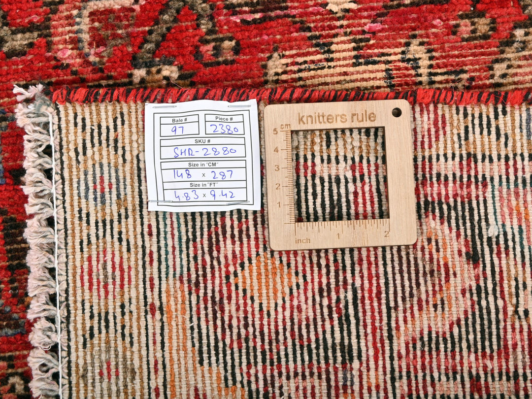 a close up of a rug with a ruler on it