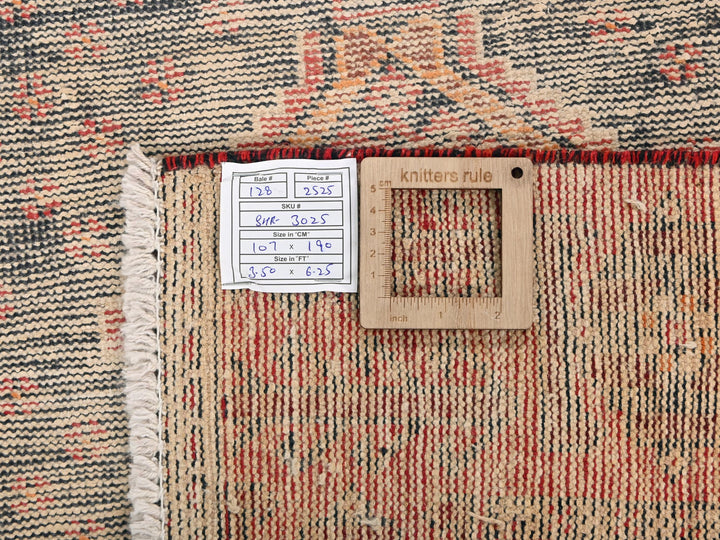 a close up of a rug with a tag on it