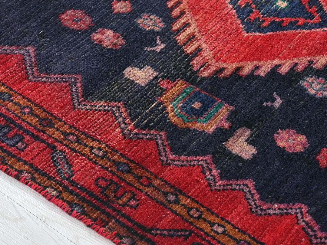 a close up of a rug on a wooden floor