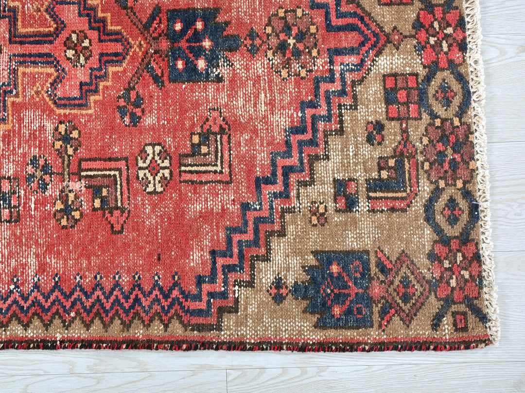 a rug with a red and blue design on it