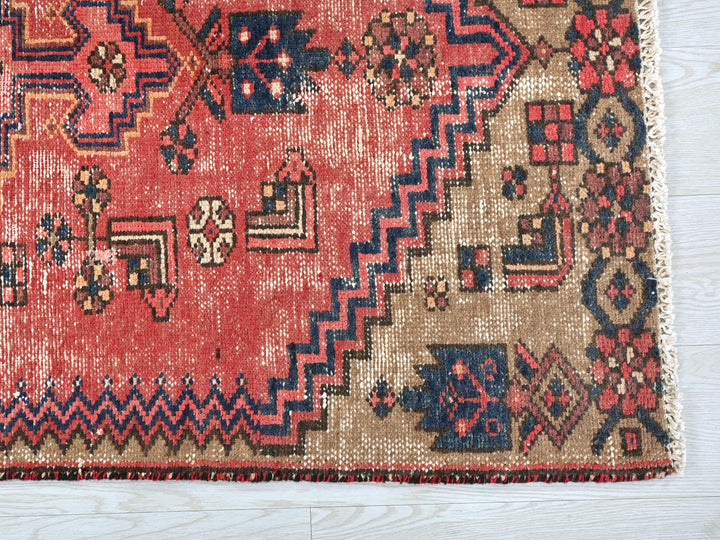a rug with a red and blue design on it
