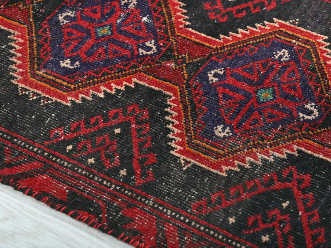 a close up of a rug on a wooden floor