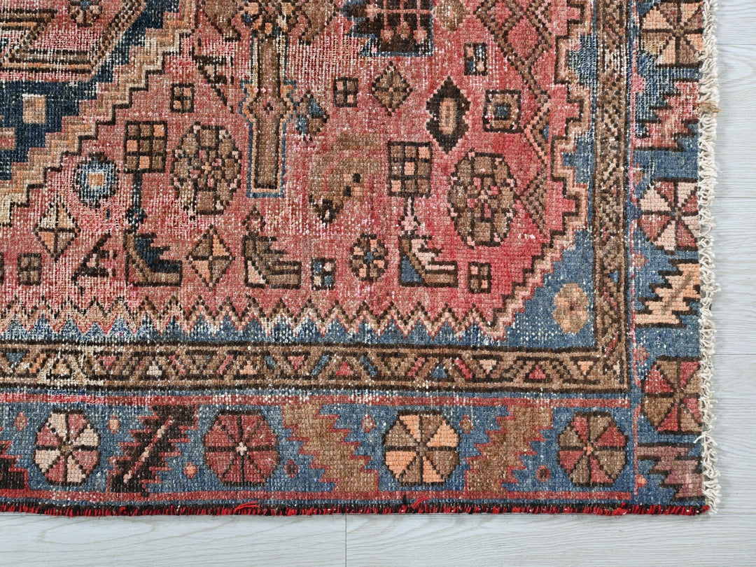 a rug with a design on it on a wooden floor