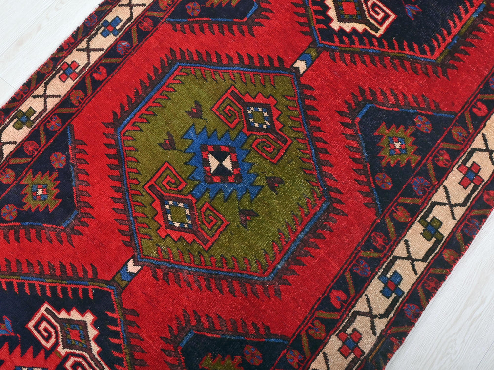 a close up of a rug on a wooden floor