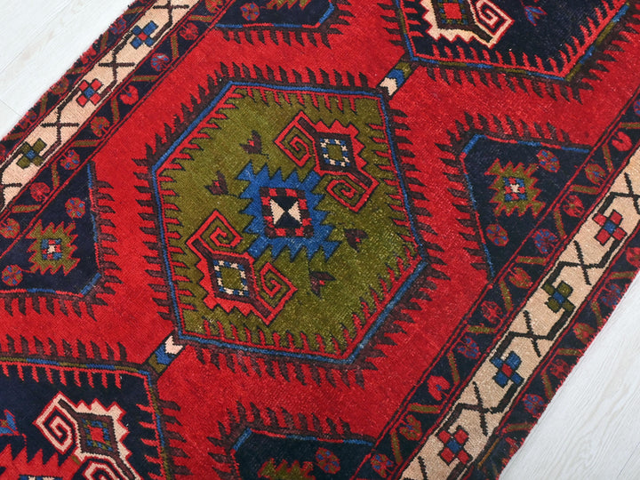 a close up of a rug on a wooden floor