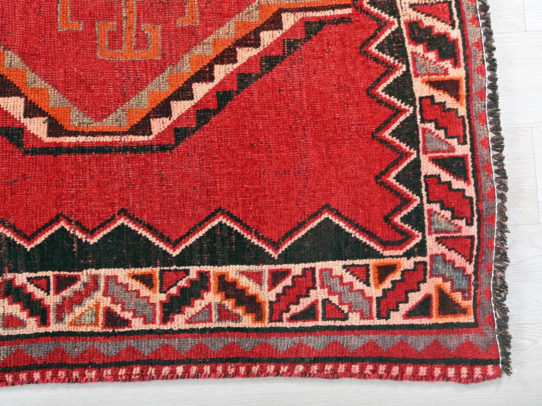 a close up of a rug on a white surface