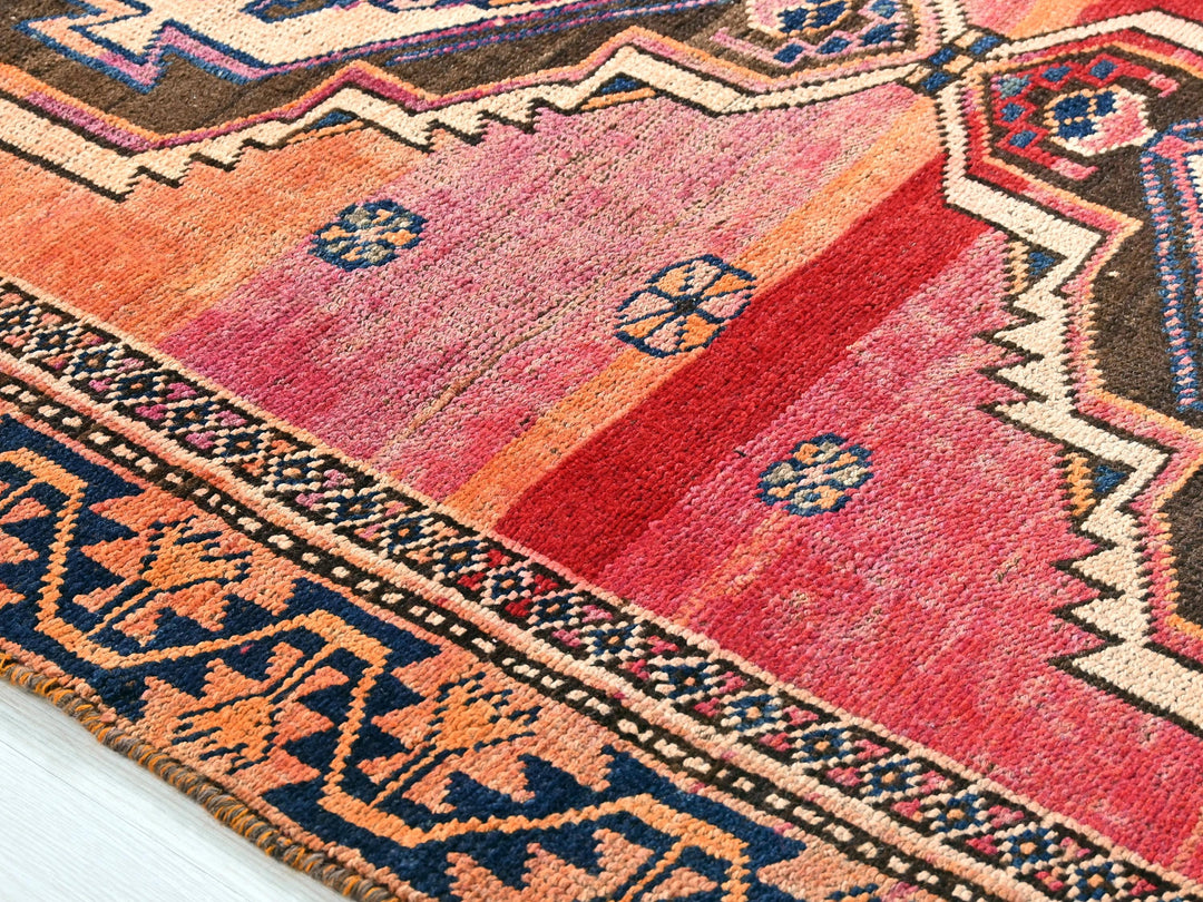 a multi colored rug with a pattern on it