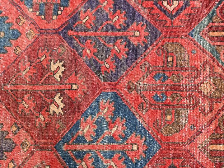 a red and blue rug with many different colors