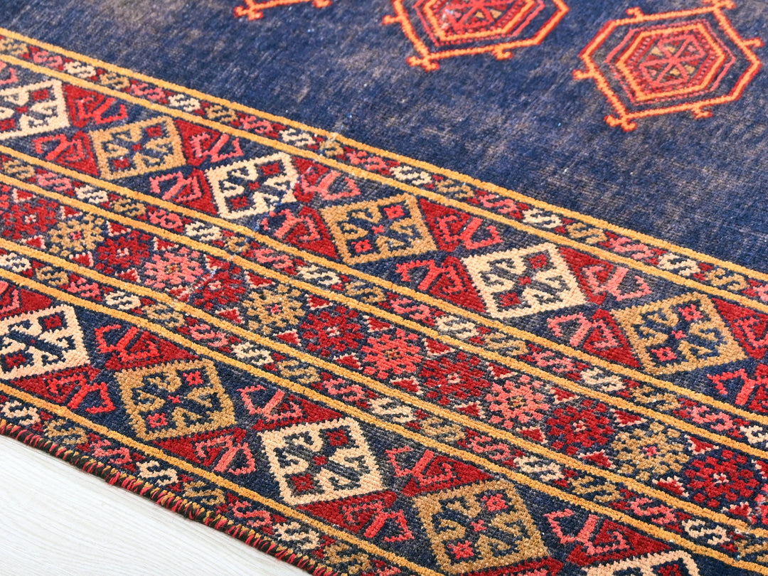 a close up of a rug on a white surface