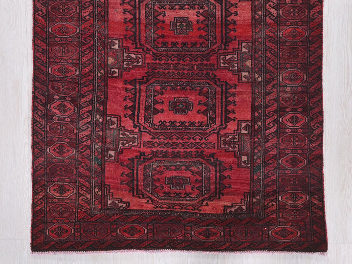 a red rug on a white floor