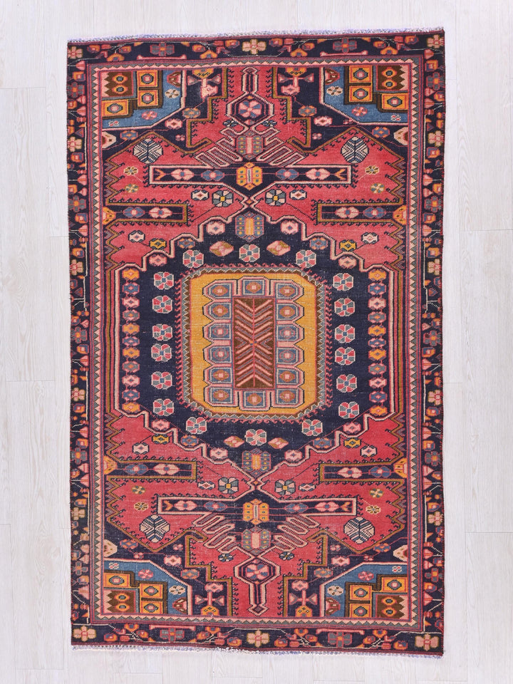 an oriental rug with a colorful design on it