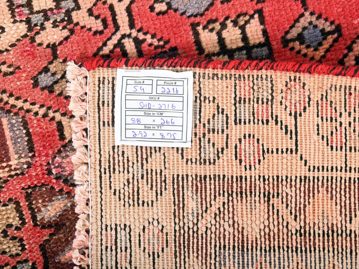 a close up of a rug with a tag on it