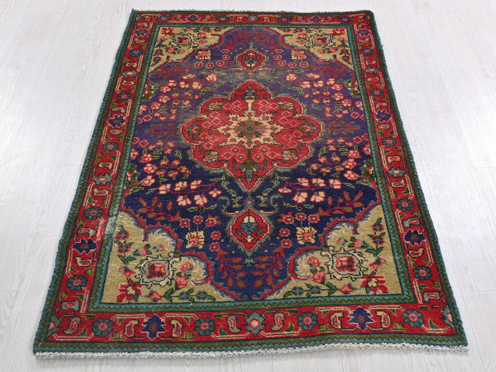 a colorful rug on a white floor in a room