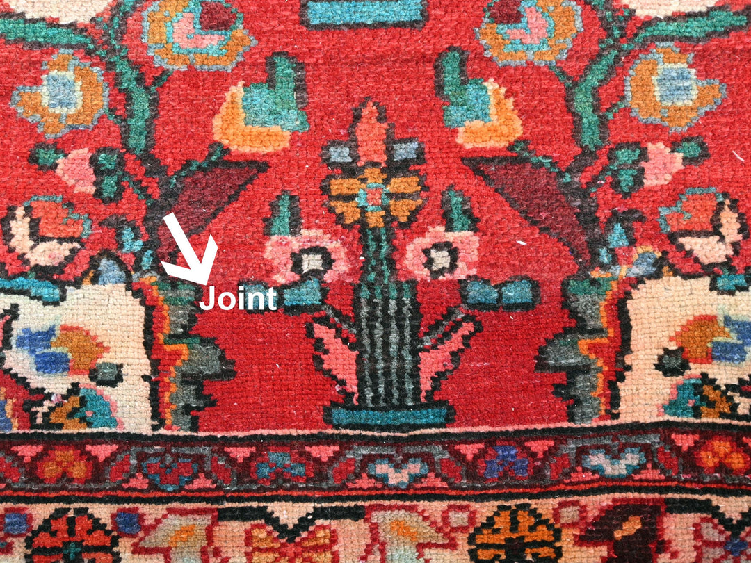 a close up of a rug with a plant on it