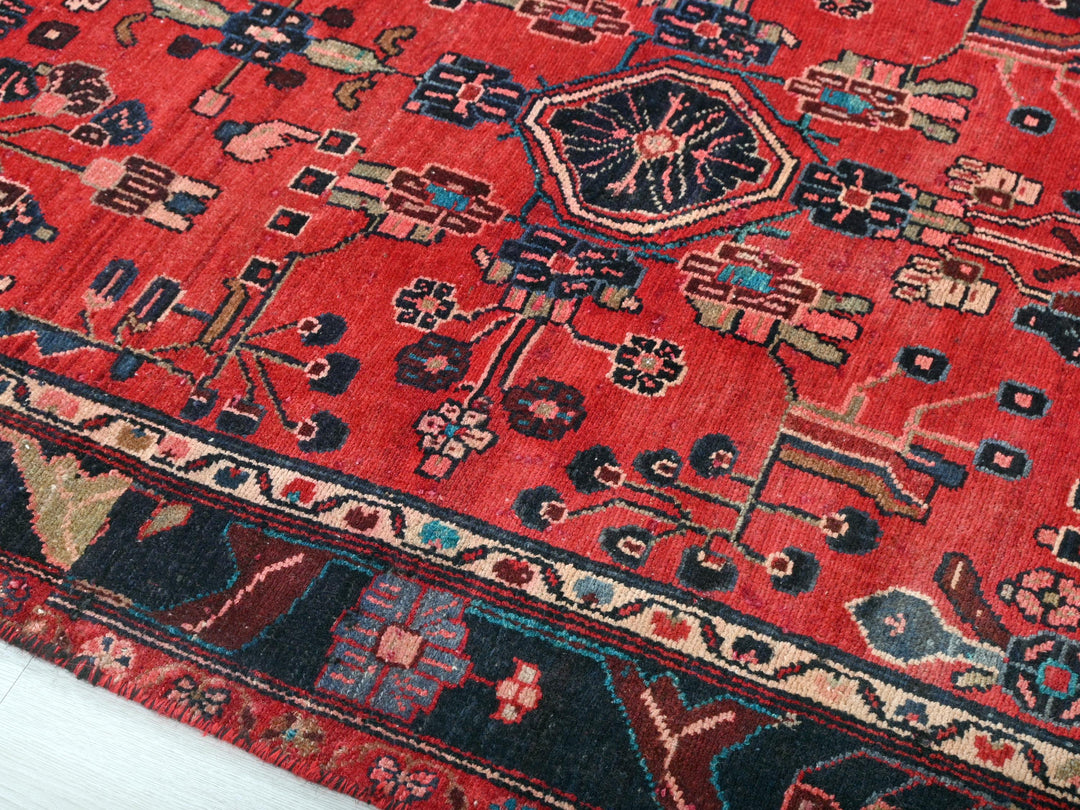 a red oriental rug on a white floor
