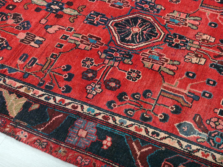 a red oriental rug on a white floor
