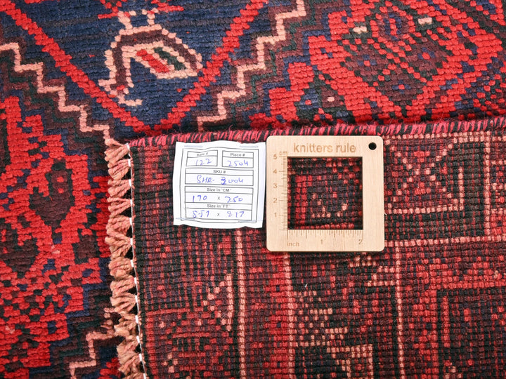 a close up of a rug with a tag on it