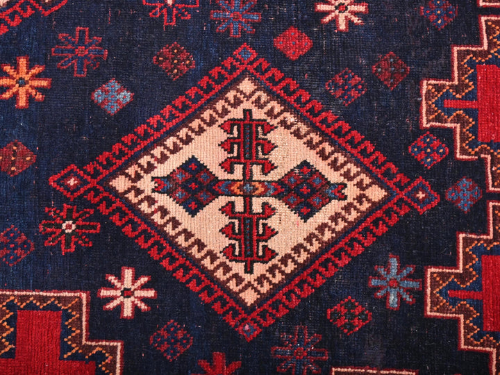 a close up of a blue and red rug