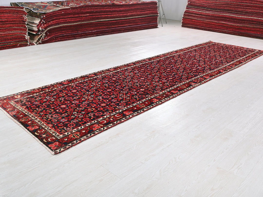 a red rug on the floor of a room