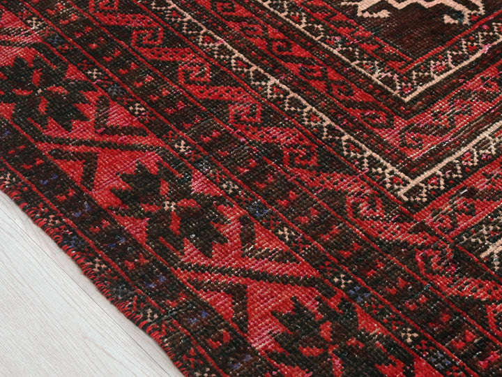 a close up of a rug on a wooden floor