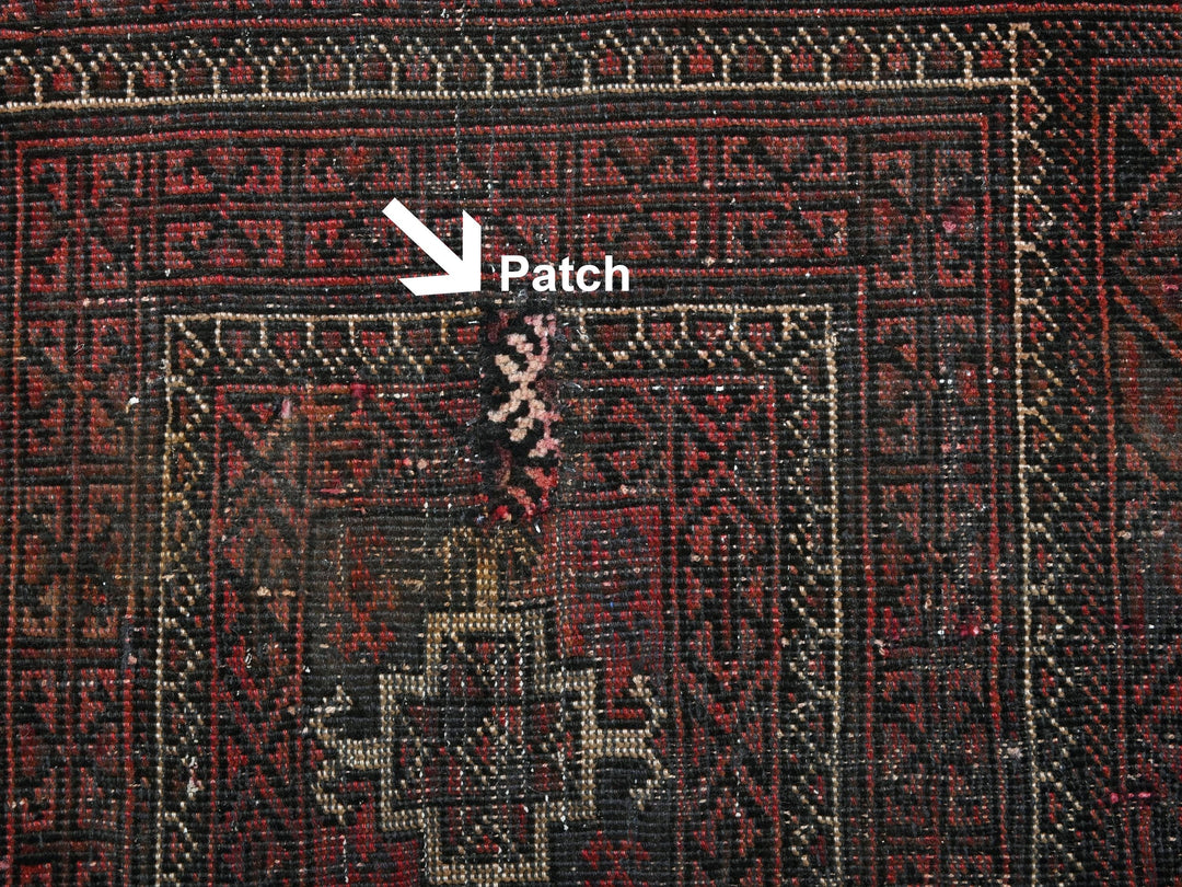 a close up of a rug with a patch on it