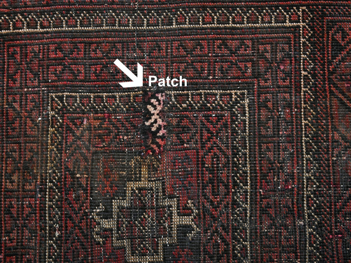 a close up of a rug with a patch on it