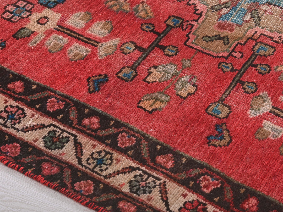 a close up of a rug on a wooden floor