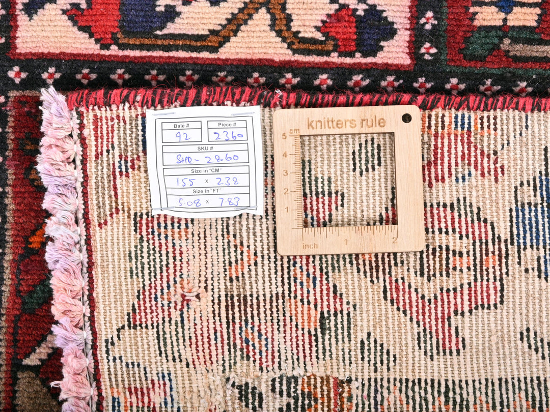 a pile of rugs with a price tag on them
