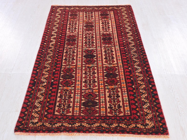 a red and black rug on a white floor
