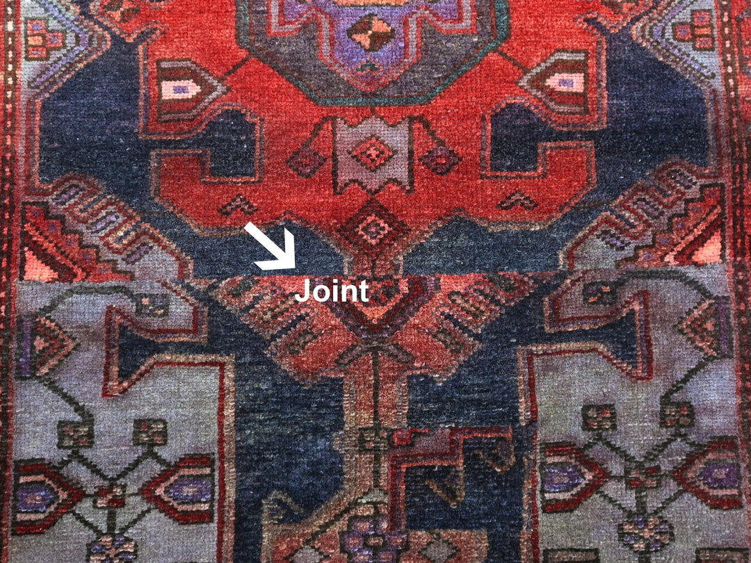 a close up of a rug with an arrow pointing to the center