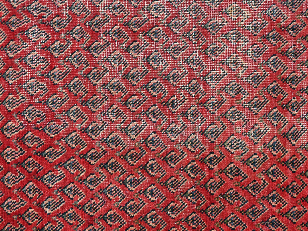 a close up of a red and black rug