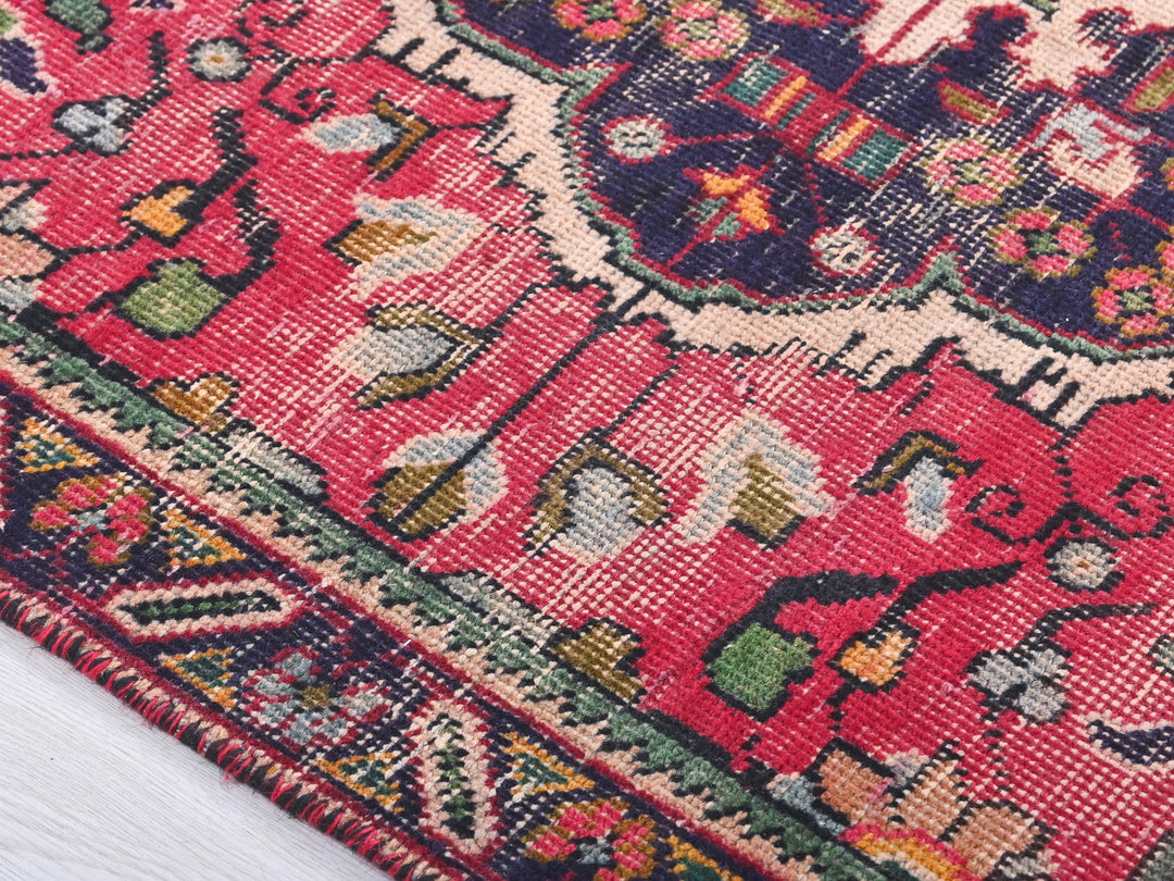a close up of a rug on a white surface
