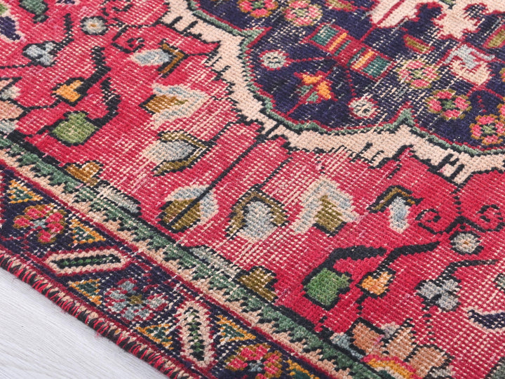 a close up of a rug on a white surface