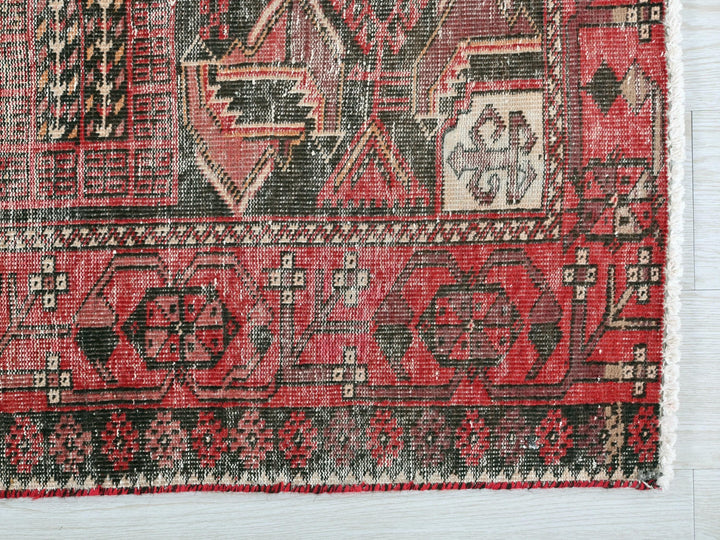 a close up of a rug on a wooden floor