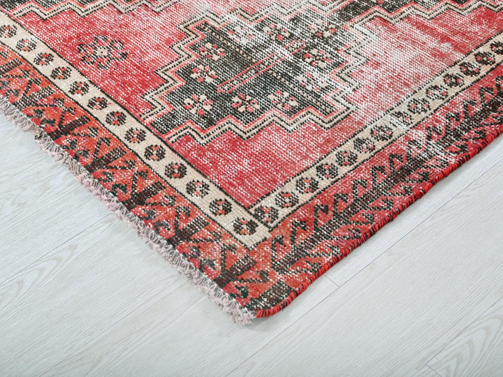 a close up of a rug on a wooden floor