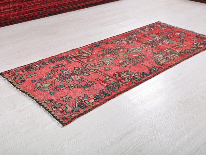 a red rug on the floor of a room