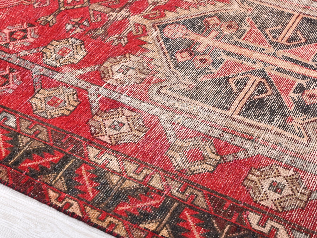 a close up of a rug on a wooden floor