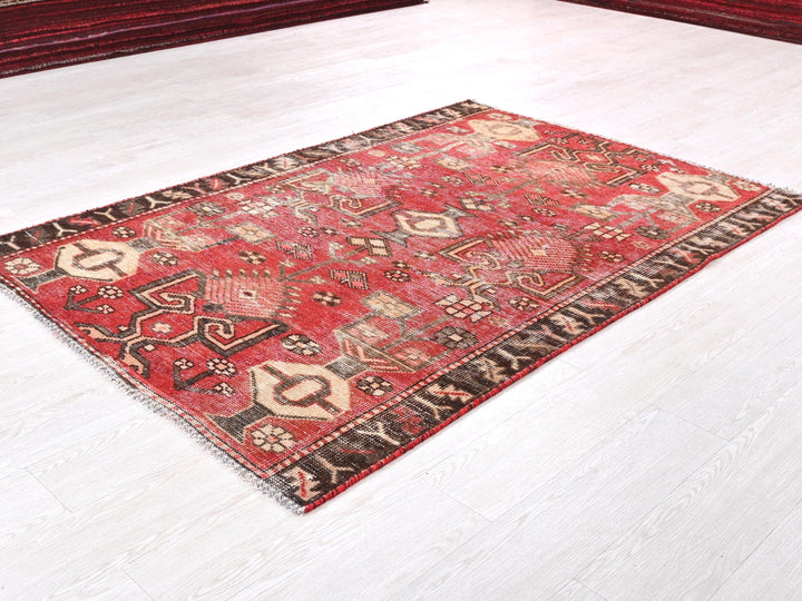 a red rug on the floor of a room