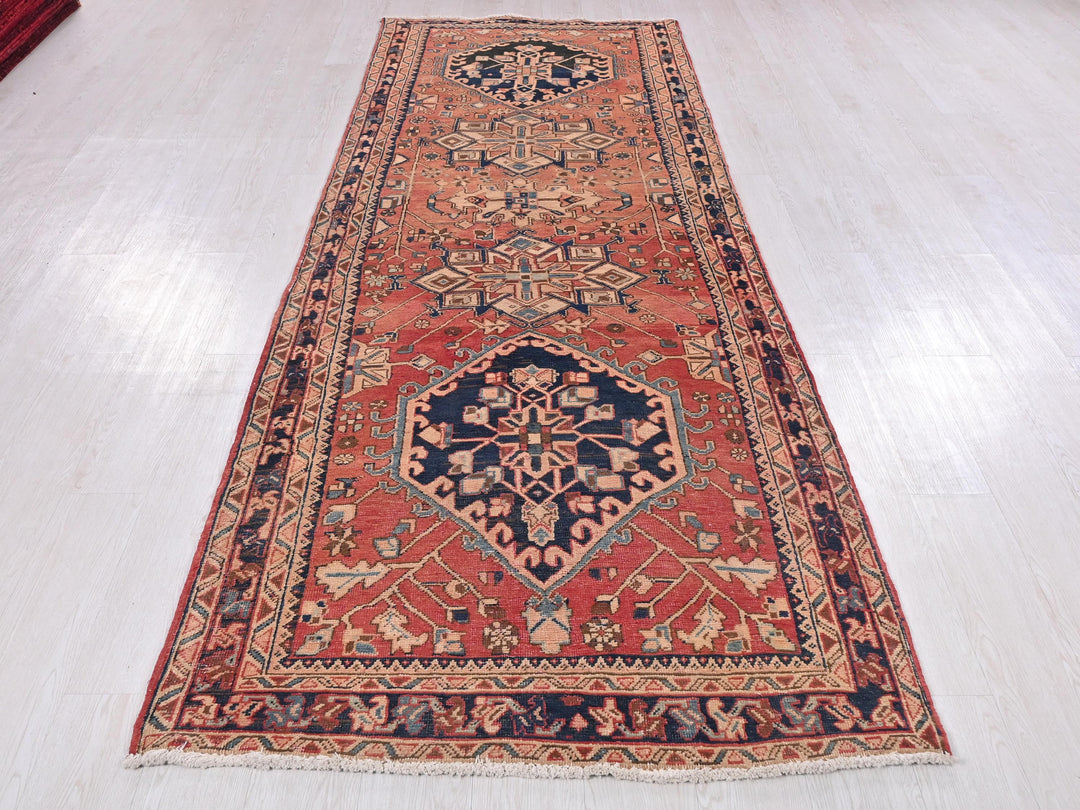 a red rug on a white floor in a room