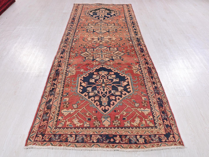 a red rug on a white floor in a room