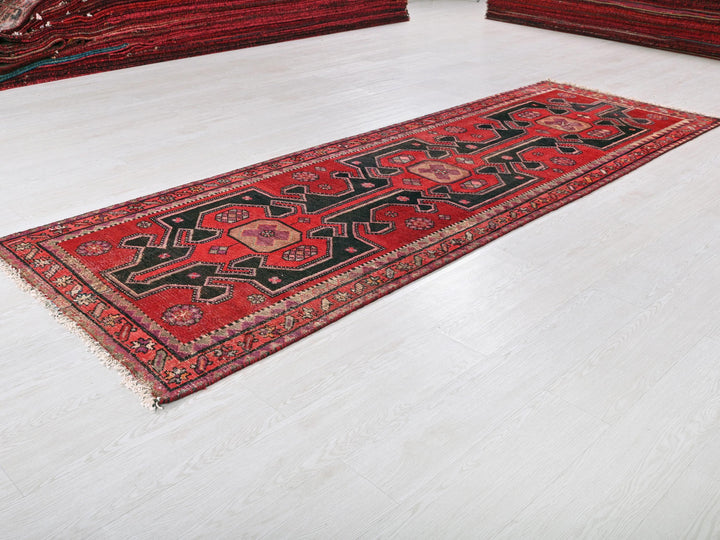 a red rug on the floor of a room