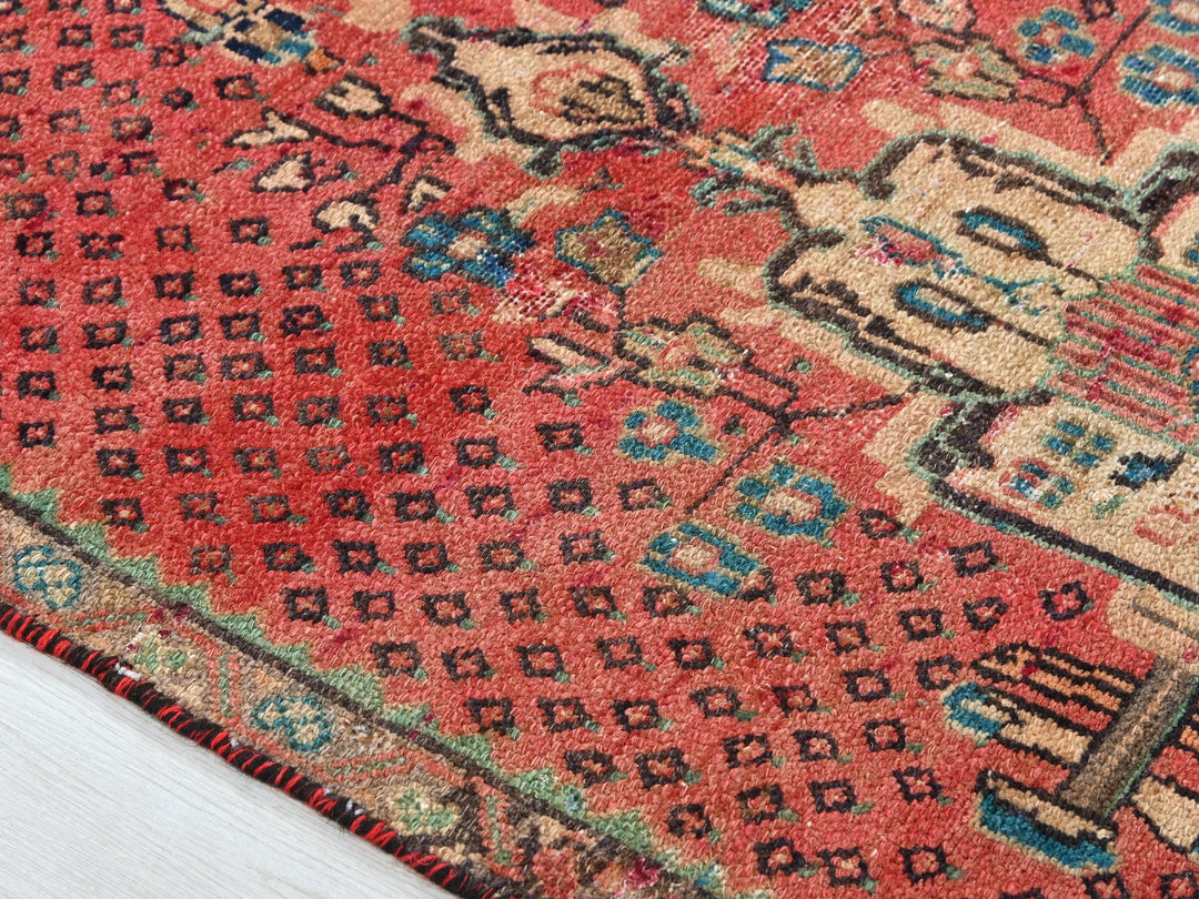 a close up of a rug with a wooden floor