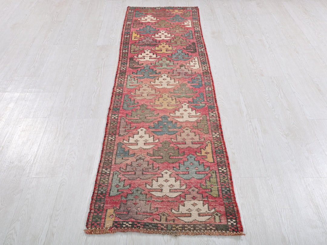 a long rug on the floor in a room