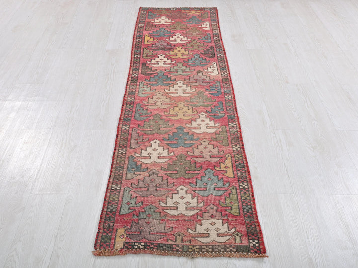 a long rug on the floor in a room