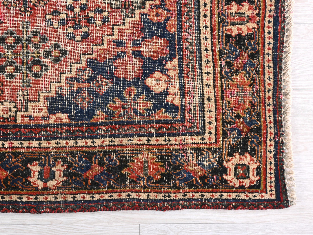 a rug with a floral design on a white background