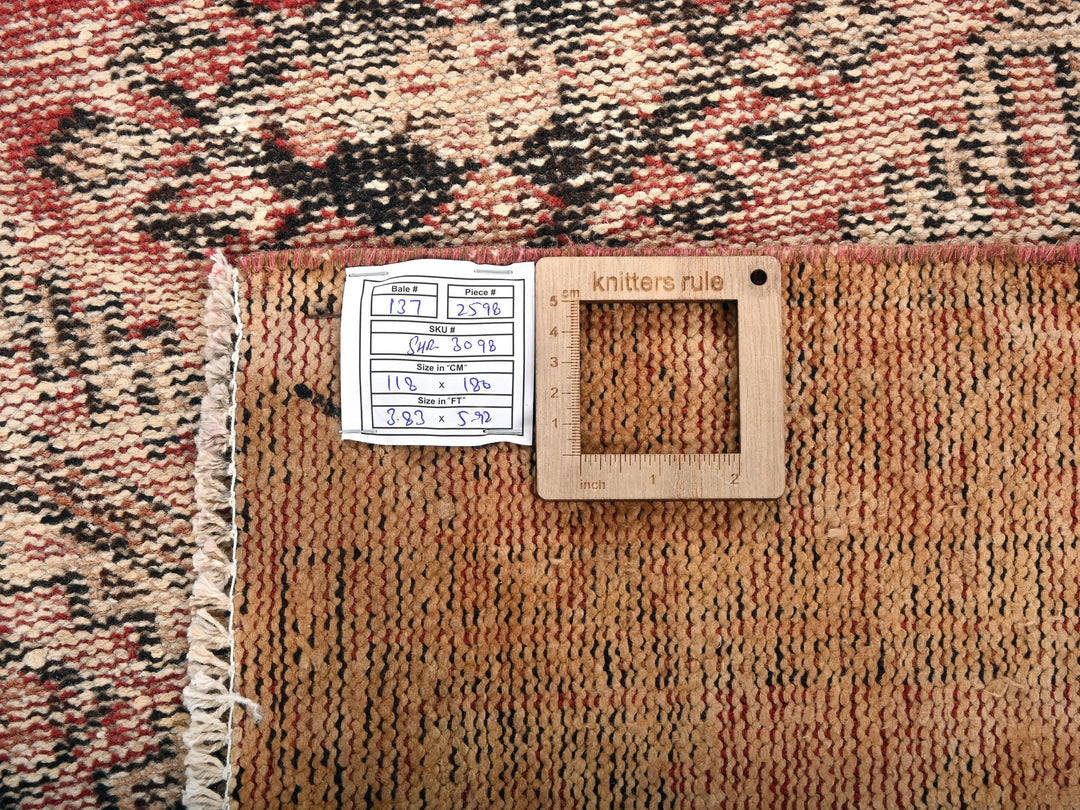 a piece of wood sitting on top of a rug