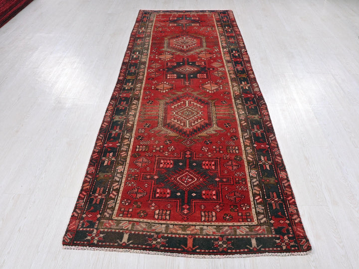 a red rug on a white floor in a room