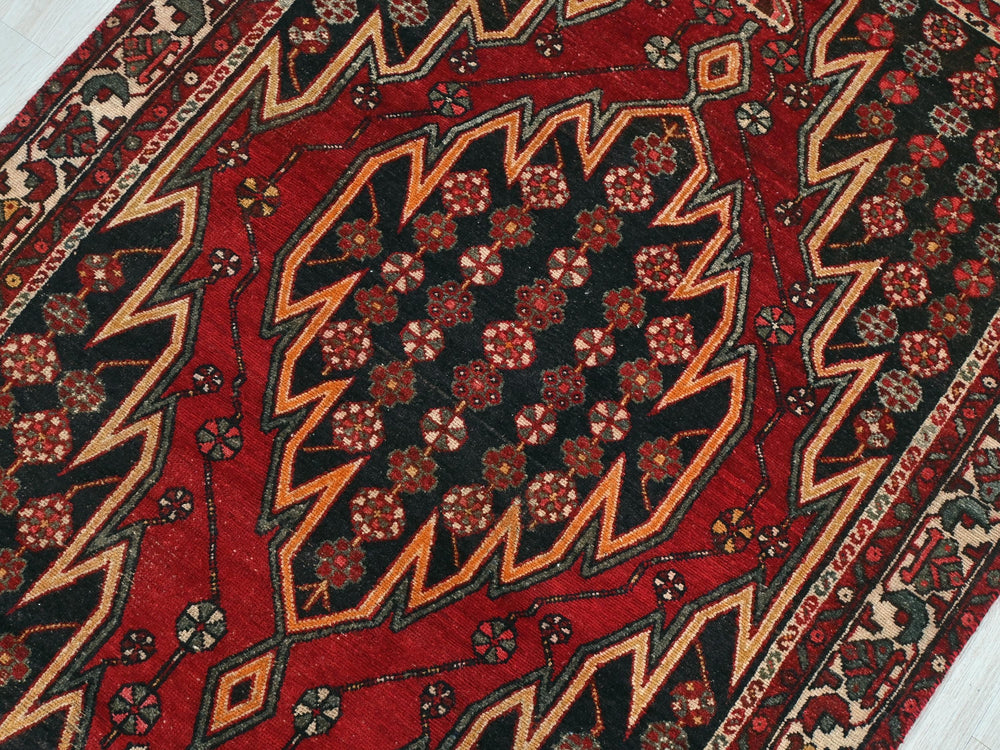 a close up of a rug on a wooden floor
