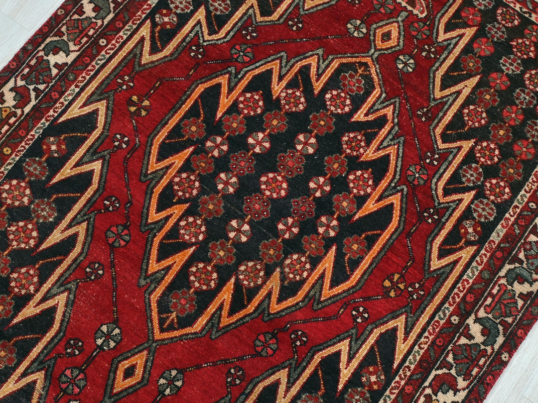 a close up of a rug on a wooden floor