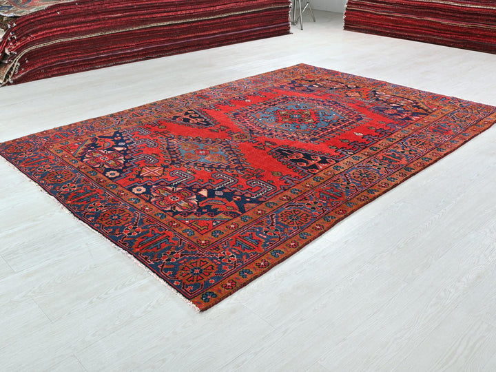 a red rug on the floor of a room